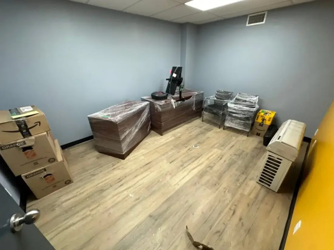 Office desks and chairs wrapped and ready to move